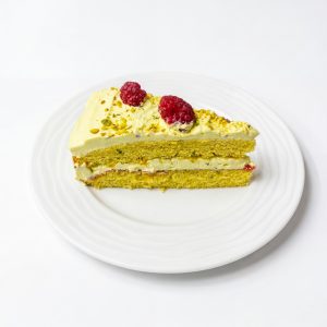 Cake with white chocolate, pistachio and raspberries